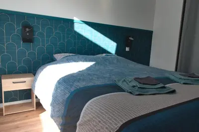 Un ou plusieurs lits dans un hébergement de l'établissement Ty-koad spa