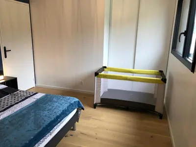 Un ou plusieurs lits dans un hébergement de l'établissement Complètement à l'ouest face à la mer