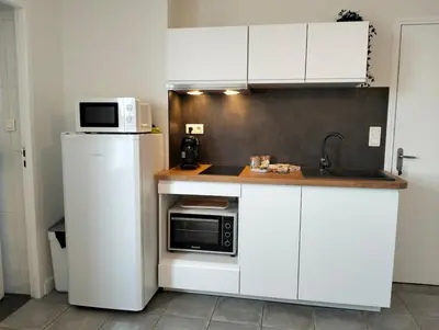 Cuisine ou kitchenette dans l'établissement Blue Marine - T2 - Centre-ville