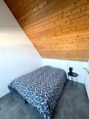 Un ou plusieurs lits dans un hébergement de l'établissement Maison en bord de mer