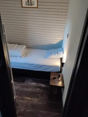Un ou plusieurs lits dans un hébergement de l'établissement Gîte magnifique vue mer