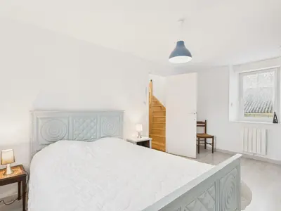 Un ou plusieurs lits dans un hébergement de l'établissement Maison pour 7 avec jardin - Quartier paisible