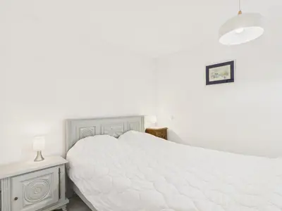 Un ou plusieurs lits dans un hébergement de l'établissement Maison pour 7 avec jardin - Quartier paisible