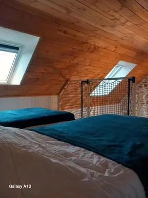 Un ou plusieurs lits dans un hébergement de l'établissement Maisonnette cosy proche de la côte