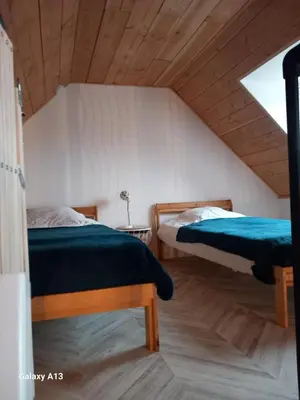 Un ou plusieurs lits dans un hébergement de l'établissement Maisonnette cosy proche de la côte