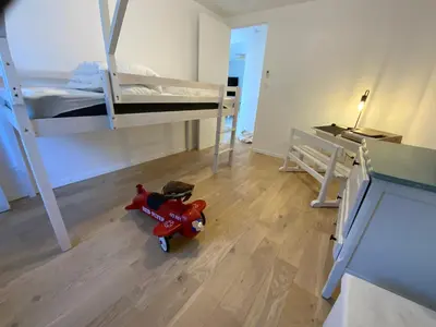 Un ou plusieurs lits dans un hébergement de l'établissement Appartement avec son jardin face au port d'Audierne