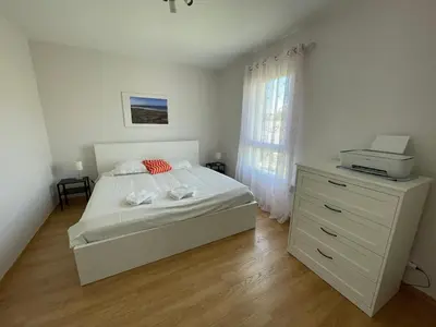Un ou plusieurs lits dans un hébergement de l'établissement Maison proche de la plage de Goulien - Kerret