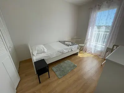 Un ou plusieurs lits dans un hébergement de l'établissement Maison proche de la plage de Goulien - Kerret