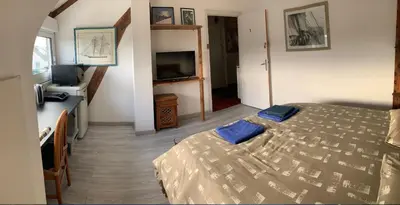 Un ou plusieurs lits dans un hébergement de l'établissement Une chambre chez l'habitant