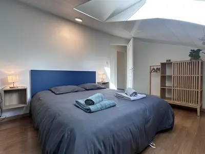 Un ou plusieurs lits dans un hébergement de l'établissement Quimper centre Duplex 2 chambres 3 étoiles - Retro Gaming