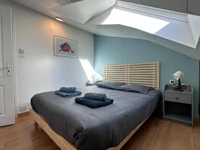 Un ou plusieurs lits dans un hébergement de l'établissement Quimper centre Duplex 2 chambres 3 étoiles - Retro Gaming