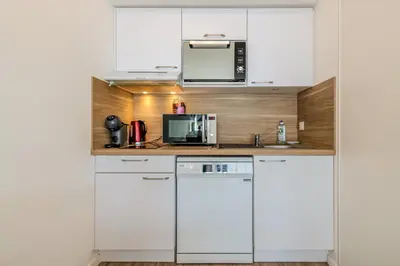 Cuisine ou kitchenette dans l'établissement Cap Lanroz - Avec terrasse
