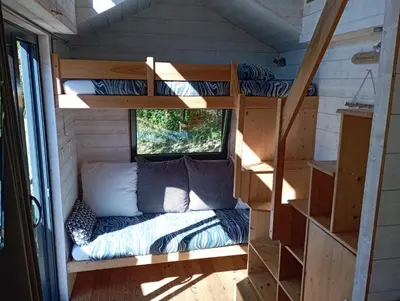 Un ou plusieurs lits dans un hébergement de l'établissement Tiny house Keremma