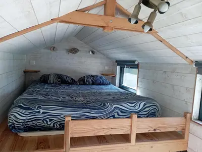 Un ou plusieurs lits dans un hébergement de l'établissement Tiny house Keremma