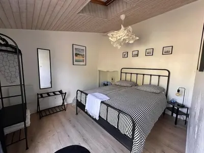 Un ou plusieurs lits dans un hébergement de l'établissement Ty Palud Gîte, piscine chauffée, spa et air marin