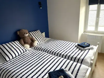 Un ou plusieurs lits dans un hébergement de l'établissement Guerlesquin village house
