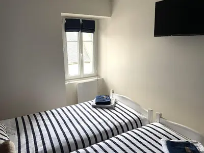 Un ou plusieurs lits dans un hébergement de l'établissement Guerlesquin village house