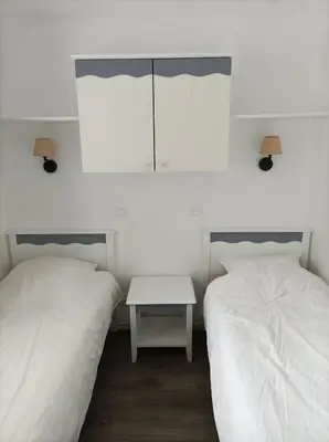 Un ou plusieurs lits dans un hébergement de l'établissement Nouveau appartement cosy vue mer