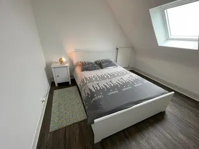 Un ou plusieurs lits dans un hébergement de l'établissement Maison rénovée avec charme, proche des plages