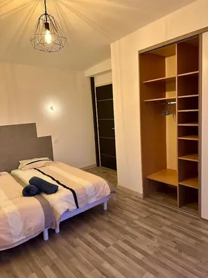 Un ou plusieurs lits dans un hébergement de l'établissement Maison proche des plages