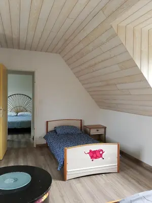 Un ou plusieurs lits dans un hébergement de l'établissement Maison proche de la mer