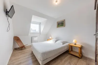 Un ou plusieurs lits dans un hébergement de l'établissement maison Rose l'Ecume à 50 m de la mer