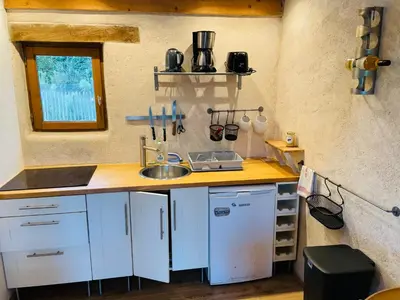 Cuisine ou kitchenette dans l'établissement Dépendance chez l'habitant
