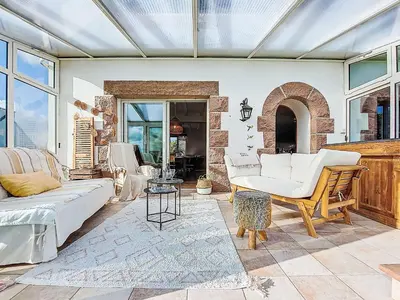 Coin salon dans l'établissement Holiday Home Le Clozic by Interhome
