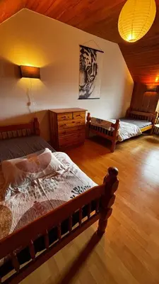 Un ou plusieurs lits dans un hébergement de l'établissement Maison Ar Vro 12 au cœur de la Bretagne