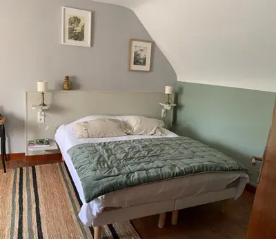Un ou plusieurs lits dans un hébergement de l'établissement Les Chambres de la Chapelle