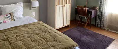 Un ou plusieurs lits dans un hébergement de l'établissement Les Chambres de la Chapelle