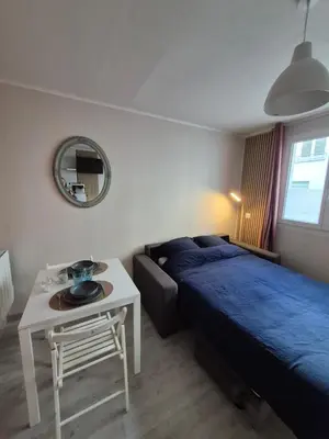 Un ou plusieurs lits dans un hébergement de l'établissement Studio cosy centre ville