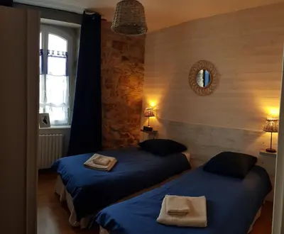 Un ou plusieurs lits dans un hébergement de l'établissement Maison les pieds dans l'eau
