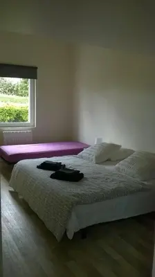 Un ou plusieurs lits dans un hébergement de l'établissement la maison de la plage