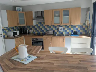 Cuisine ou kitchenette dans l'établissement Maison plein bourg pays bigouden