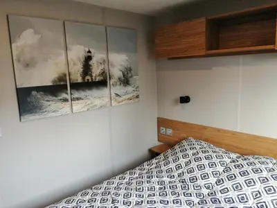 Un ou plusieurs lits dans un hébergement de l'établissement Charmant mobil-home Pont-Aven