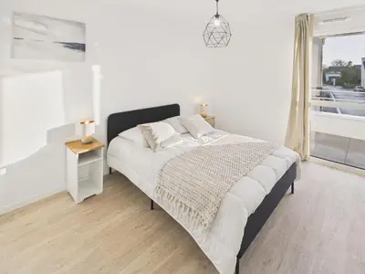 Un ou plusieurs lits dans un hébergement de l'établissement Plein centre ville - Appart pour 2 avec balcon