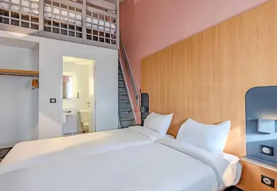 Un ou plusieurs lits dans un hébergement de l'établissement B&B HOTEL Brest Kergaradec Aéroport