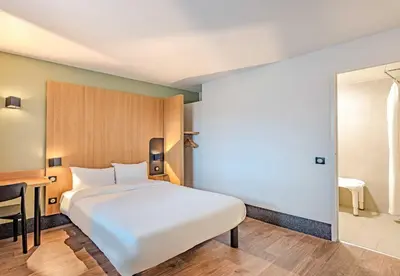 Un ou plusieurs lits dans un hébergement de l'établissement B&B HOTEL Brest Kergaradec Aéroport