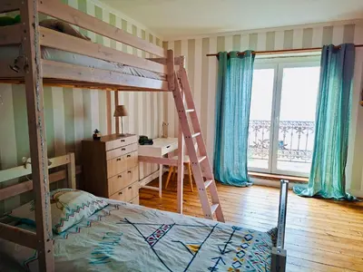 Un ou plusieurs lits dans un hébergement de l'établissement Maison familiale spacieuse 4 chambres & jardin clos