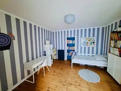 Un ou plusieurs lits dans un hébergement de l'établissement Maison familiale spacieuse 4 chambres & jardin clos