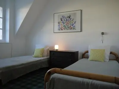 Un ou plusieurs lits dans un hébergement de l'établissement Maison Ville - Plage - Concarneau