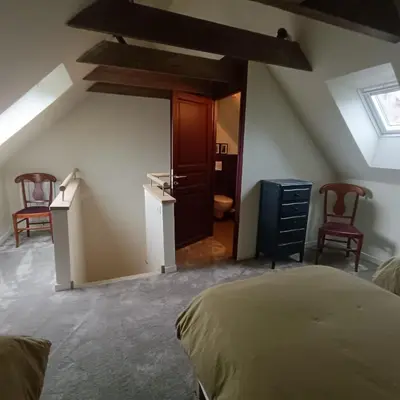 Un ou plusieurs lits dans un hébergement de l'établissement Les chambres du Lohan
