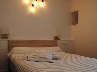 Un ou plusieurs lits dans un hébergement de l'établissement Holiday Home Großes Haus mit überdachtem und beheiztem Swimmingpool by Interhome