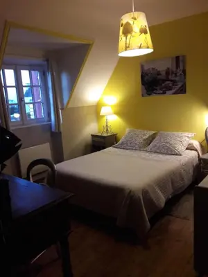 Un ou plusieurs lits dans un hébergement de l'établissement Chambre d'hôtes La Maison du Neuilly