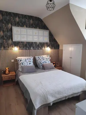 Un ou plusieurs lits dans un hébergement de l'établissement Kastell-Mor 2 chambres au calme vue jardin - proche Roscoff