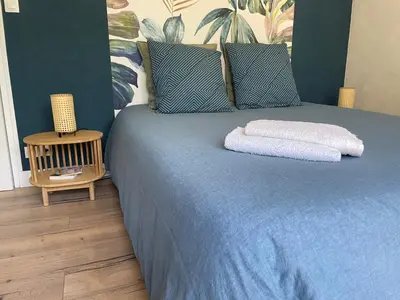 Un ou plusieurs lits dans un hébergement de l'établissement La Chambre Bleue