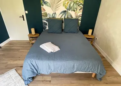 Un ou plusieurs lits dans un hébergement de l'établissement La Chambre Bleue