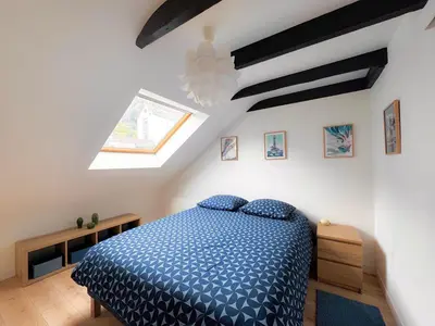 Un ou plusieurs lits dans un hébergement de l'établissement Le Penthouse Quimper Gare & Centre Ville