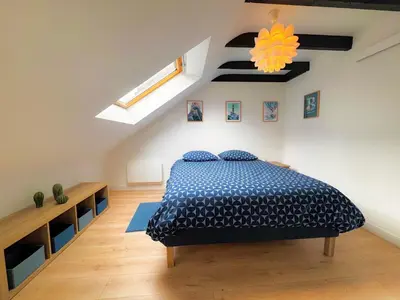 Un ou plusieurs lits dans un hébergement de l'établissement Le Penthouse Quimper Gare & Centre Ville